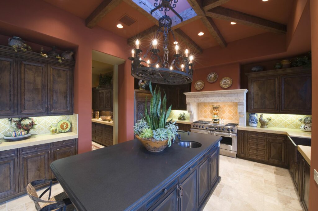 a kitchen with a chandelier hanging from the ceiling